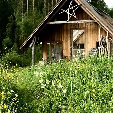 Old Farmstead With Log By River At Lonin *